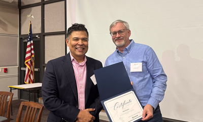 Completion certificate for LLNJ’s PM Fundamentals + AI Integration Bootcamp, presented by Sam Sena (left) to Ralph Bingham, LibraryLinkNJ