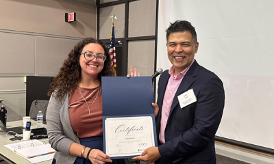 Completion certificate for LLNJ’s PM Fundamentals + AI Integration Bootcamp, presented by Sam Sena (right) to Darby Malvey, LibraryLinkNJ